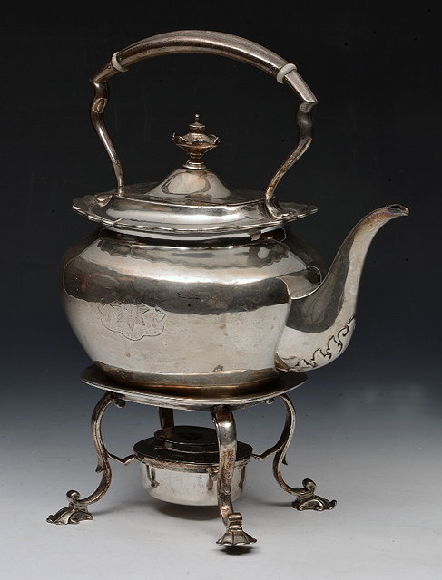 Appraisal: AN EDWARDIAN SILVER KETTLE ON STAND plain oval kettle with