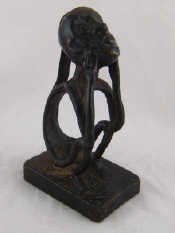 Appraisal: An African bronze of a seated native ht cm