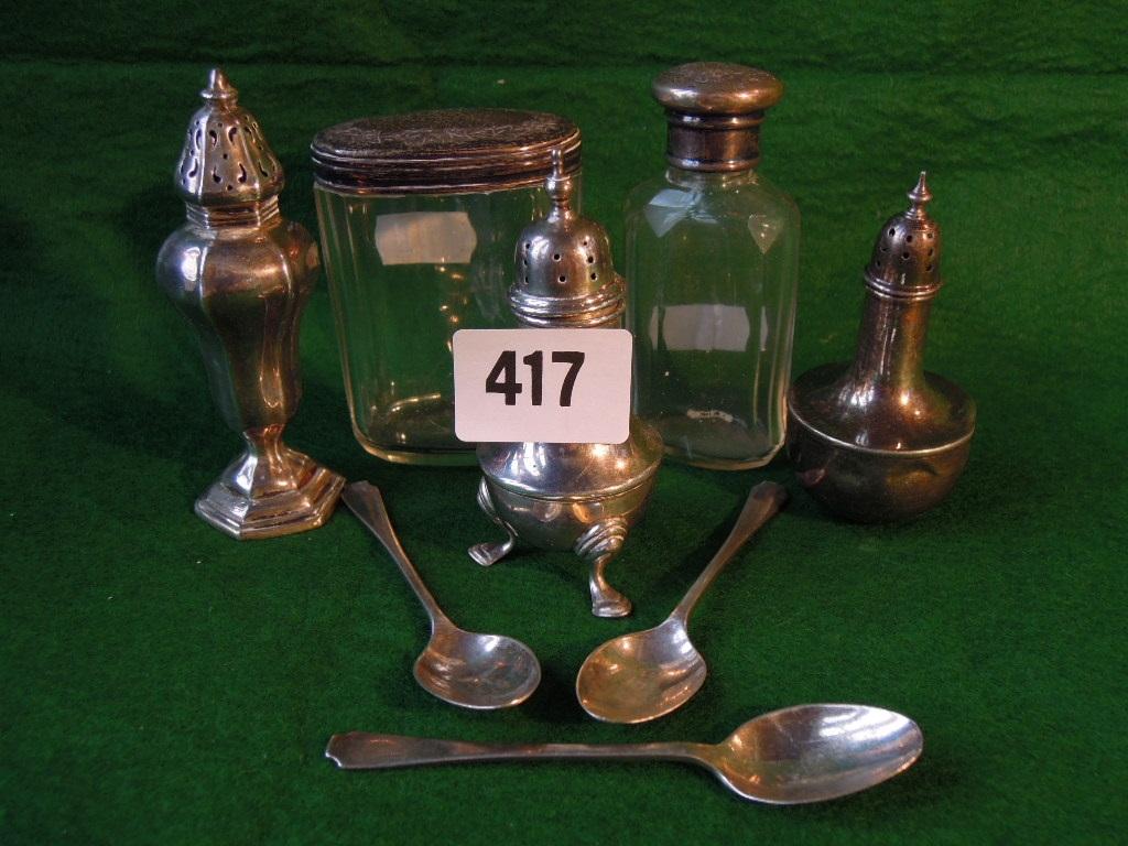 Appraisal: A small quantity of silver table ware including three pepper