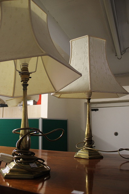 Appraisal: A PAIR OF BRASS COLUMN TABLE LAMPS with hexagonal bases