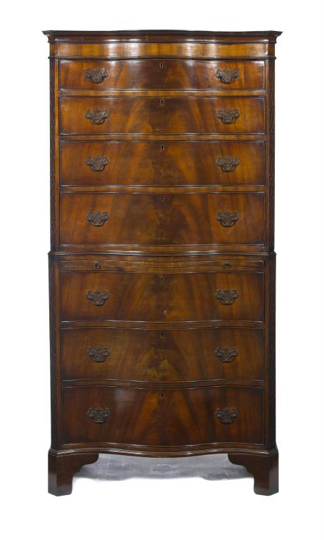 Appraisal: A MAHOGANY SERPENTINE CHEST-ON-CHEST fitted with seven graduated drawers and