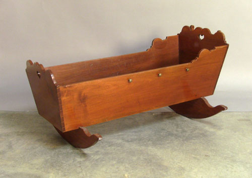 Appraisal: Walnut cradle with heart cutouts