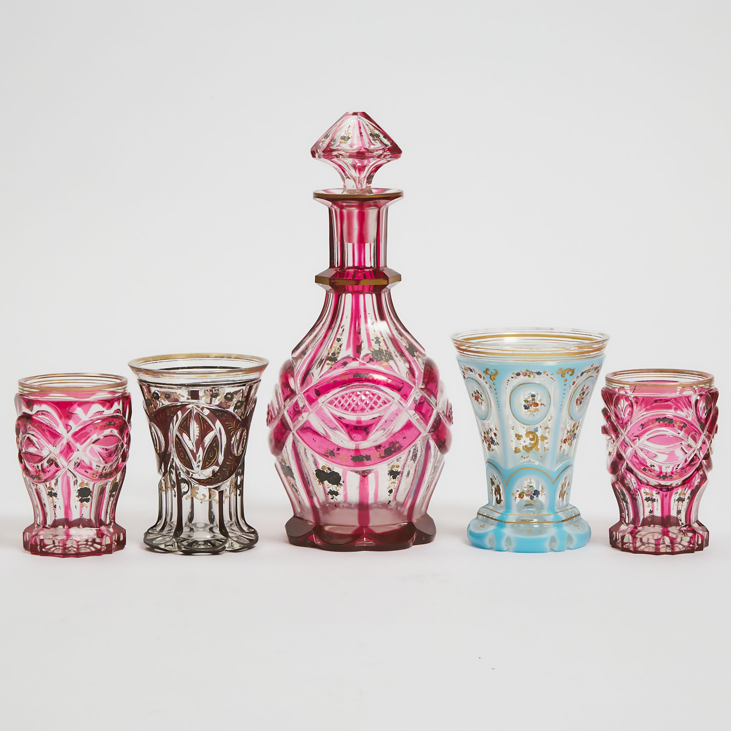 Appraisal: Four Bohemian Overlaid Cut and Enameled or Gilt Glass Beakers