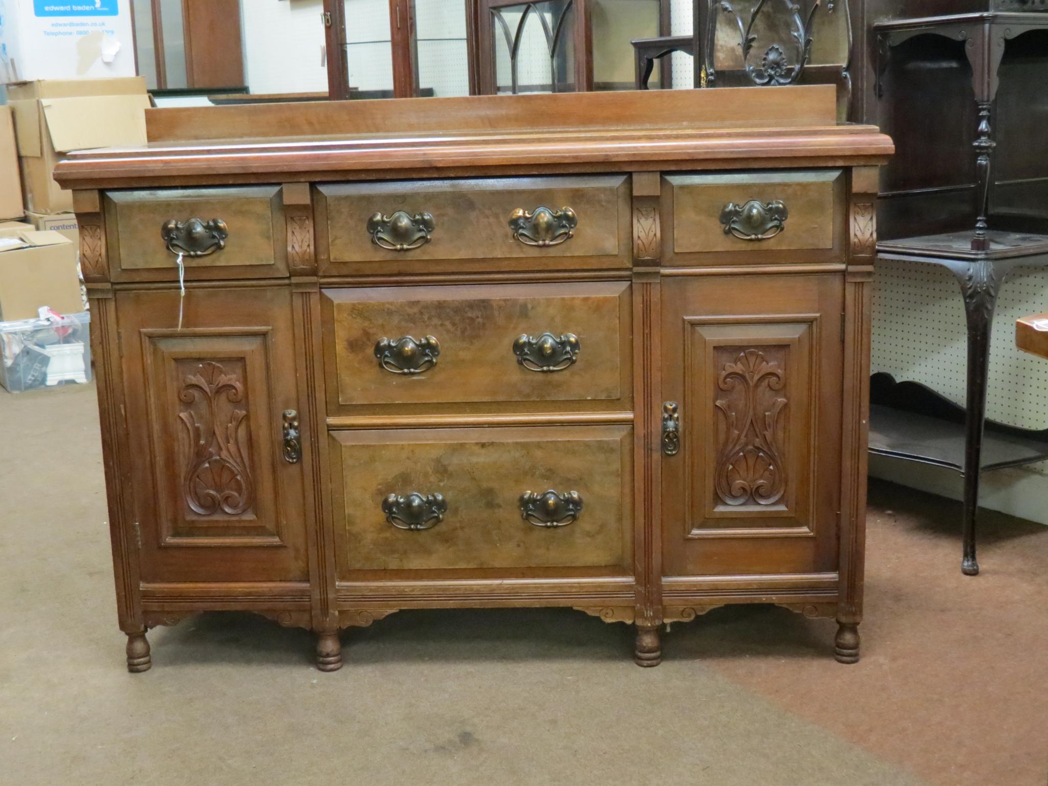 Appraisal: A late Victorian walnut sideboard by Moss Brothers Halifax three