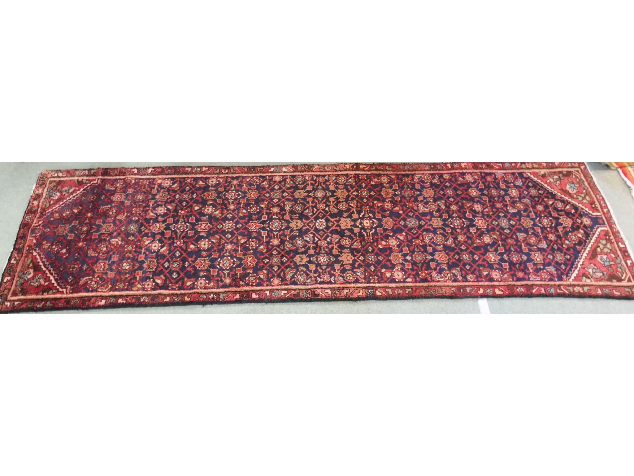 Appraisal: A traditional blue ground Persian runner x cm