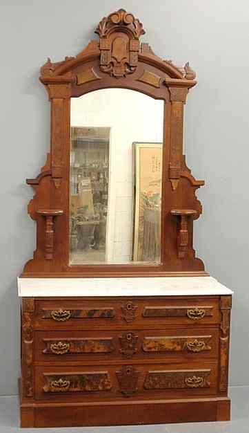 Appraisal: Victorian carved walnut dresser with mirror c with a marble