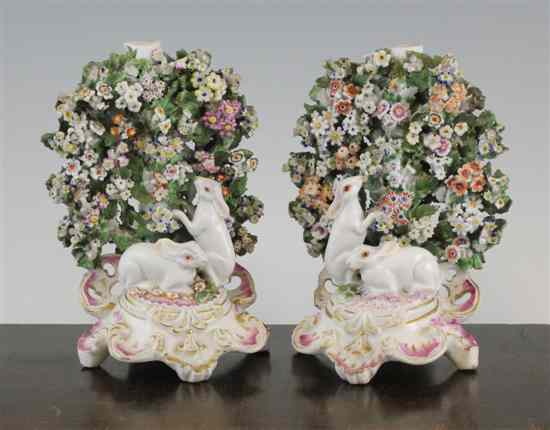 Appraisal: A pair of Chelsea Derby candlesticks c each modelled with