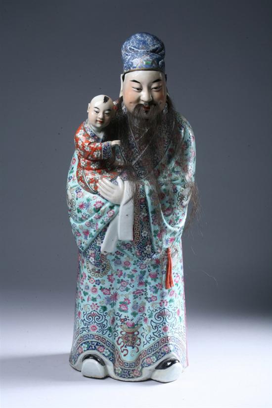 Appraisal: CHINESE FAMILLE ROSE PORCELAIN FIGURE OF MAN AND CHILD Qing