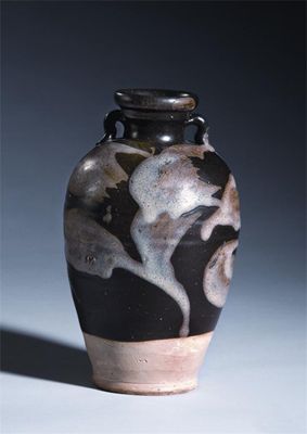 Appraisal: A Chinese phosphatic-glazed two-handled vase with splashed abstract designs on