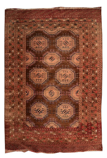 Appraisal: AN AFGHAN MID BROWN GROUND RUG with a design of