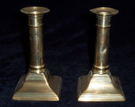 Appraisal: A pair of Victorian brass candlesticks with gun barrel columns