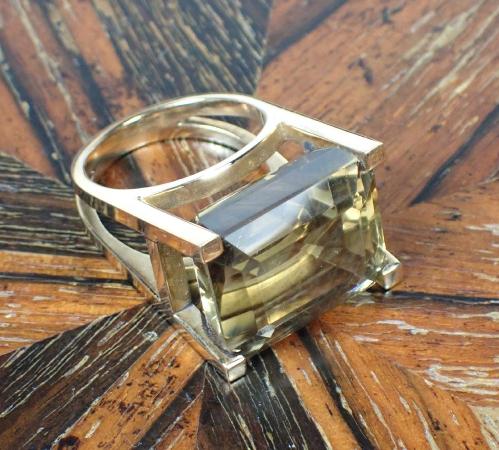 Appraisal: SMOKY QUARTZ AND FOURTEEN KARAT GOLD SOLITAIRE RING The k