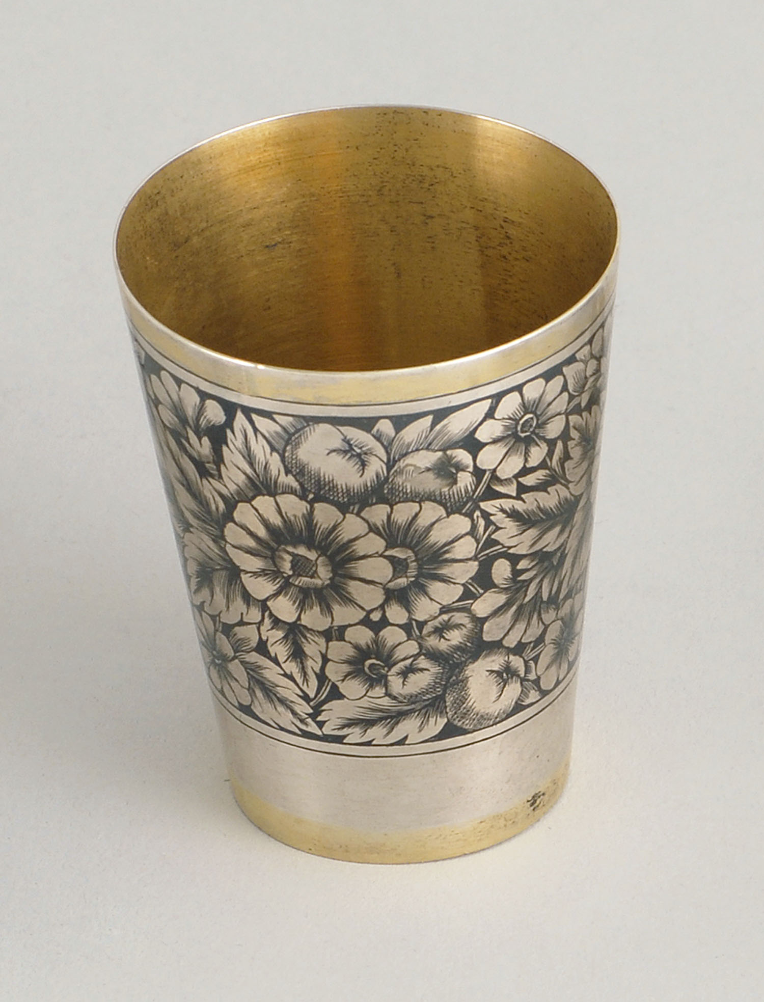 Appraisal: RUSSIAN SILVER GILT NIELLO SHOT GLASS Early th CenturyIn floral