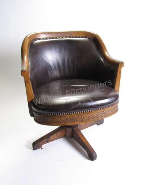 Appraisal: Romweber Viking Oak Swivel Chair R- with black naugahyde and