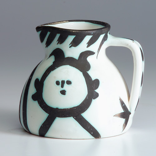 Appraisal: PICASSO MADOURA Pitcher decorated in wax-resist with primitive faces and