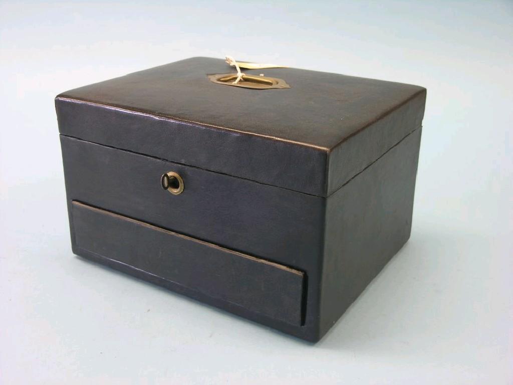 Appraisal: A Victorian leather combination vanity case writing box with interior