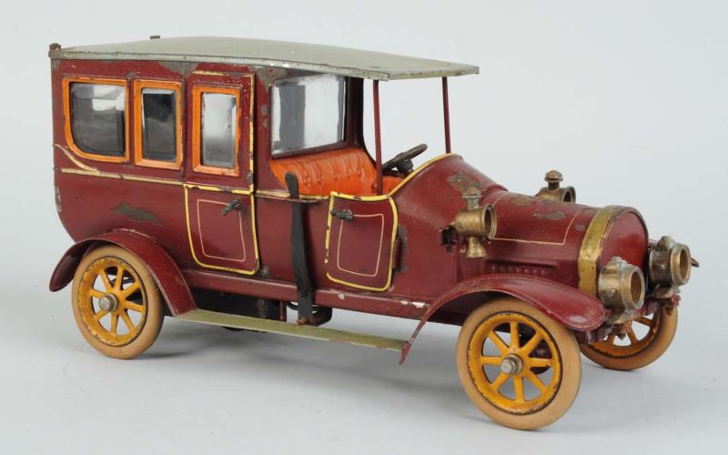 Appraisal: German Bing Clockwork Handpainted Limousine Original diecast headlights Replaced rubber