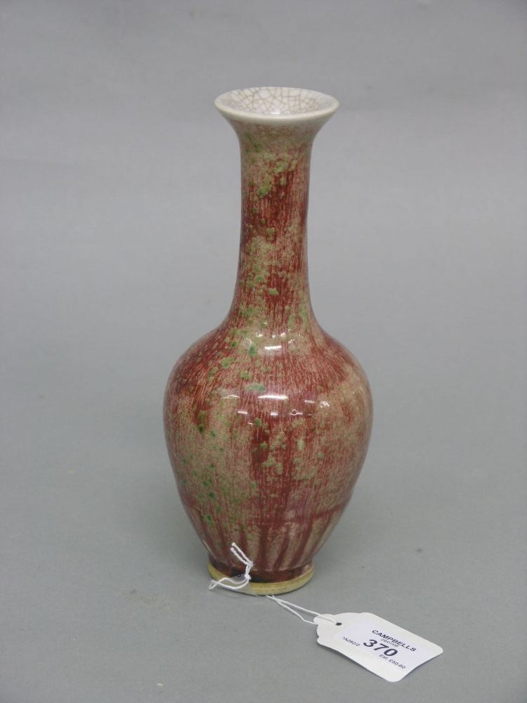 Appraisal: A Chinese porcelain baluster vase streaked crimson glaze effects against