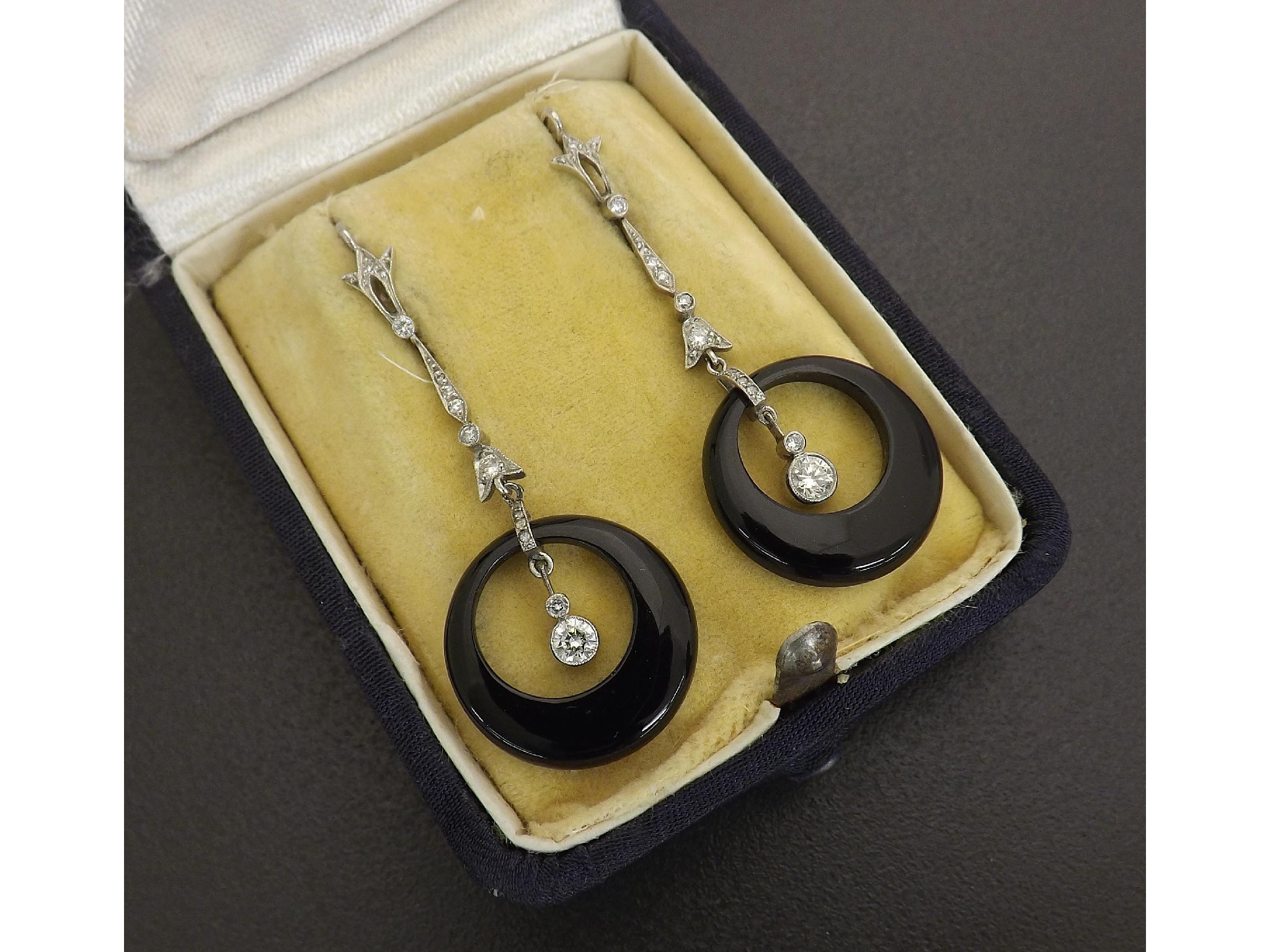 Appraisal: Attractive pair of diamond and onyx drop earrings set in