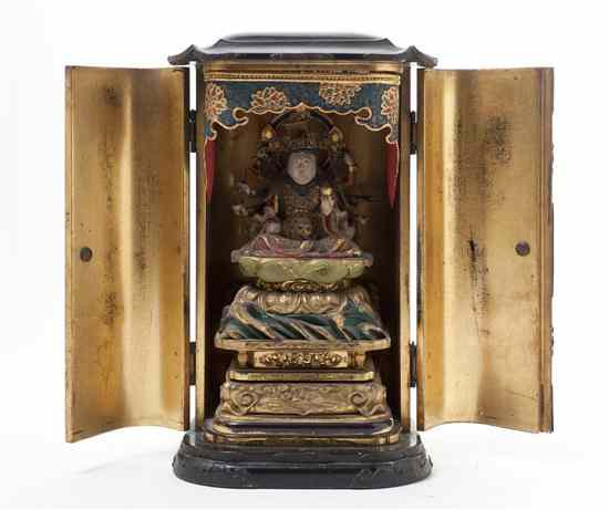 Appraisal: A Japanese Lacquered and Gilt Traveling Shrine containing a multi-armed