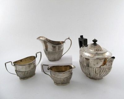 Appraisal: A three-piece matched Victorian silver tea set oval form part