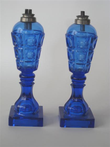 Appraisal: Pair of cobalt blue pressed 'three-printie block' pattern glass whale