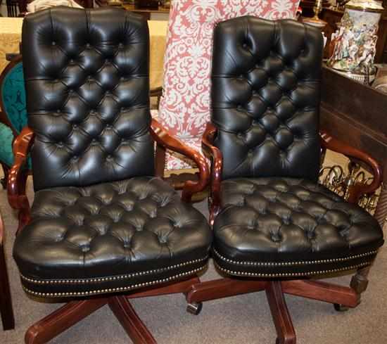 Appraisal: Pair of cherrywood leather button-back upholstered swivel office armchairs Estimate