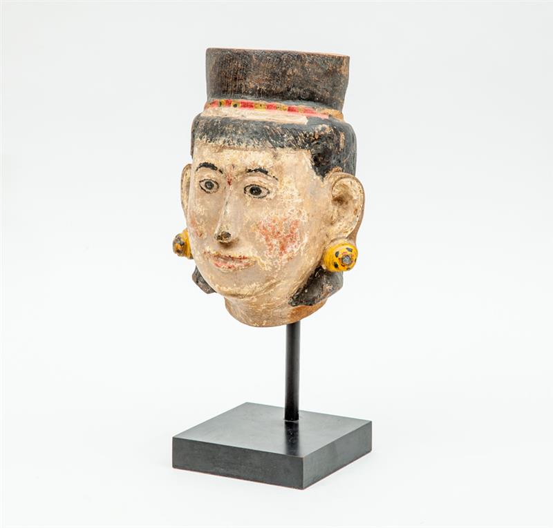 Appraisal: CARVED AND PAINTED WOOD HEAD Wearing banded pill box and