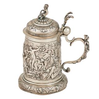 Appraisal: GERMAN SILVER REPOUSSE TANKARD Depicting scenes of Bacchus and his