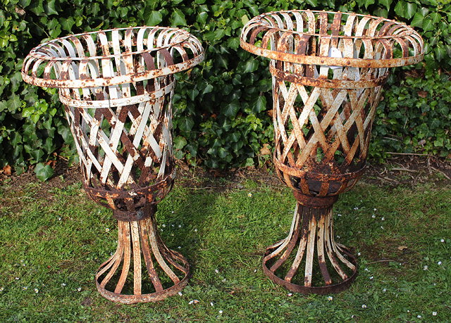 Appraisal: A PAIR OF TH CENTURY CONTINENTAL IRON STRAPWORK PLANTERS with