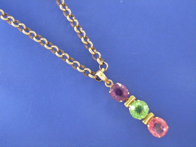 Appraisal: A ct gold spinel peridot and pink topaz pendant on