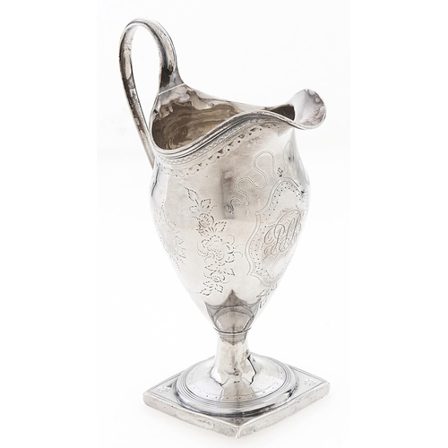 Appraisal: A George III helmet shaped silver cream jug with reeded