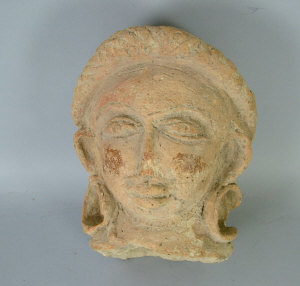 Appraisal: An Antique terracotta fragment of a head possibly African continent