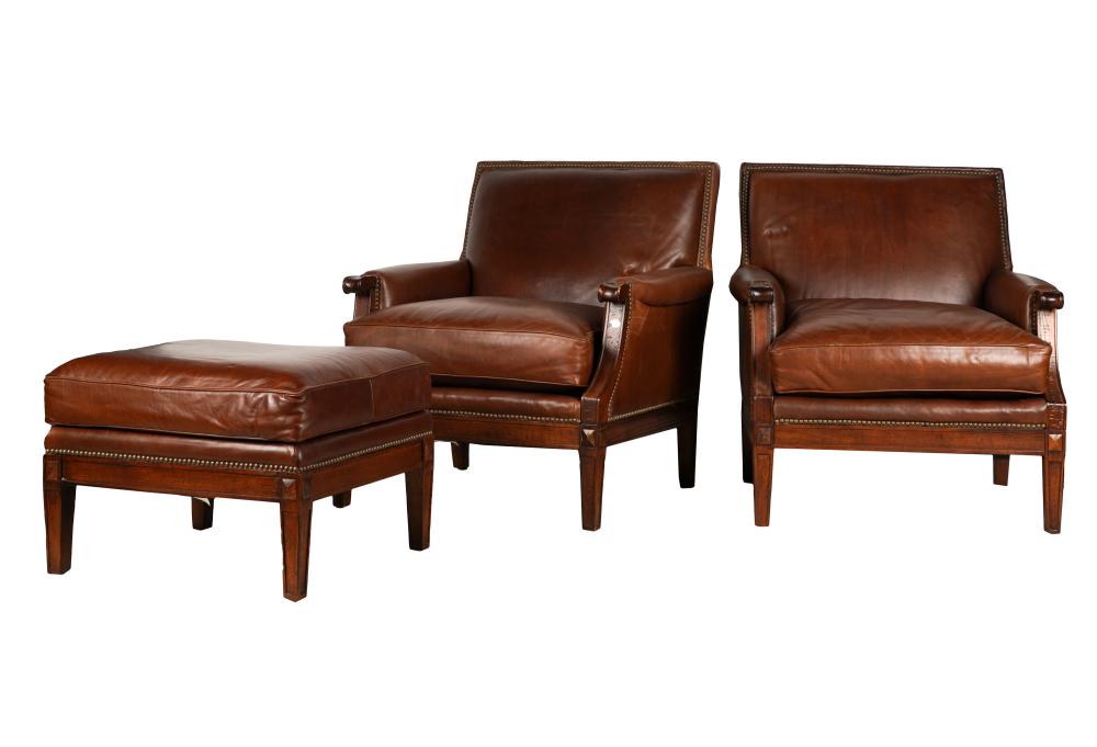 Appraisal: PAIR OF BROWN LEATHER ARMCHAIRS AN OTTOMANeach with Crate and