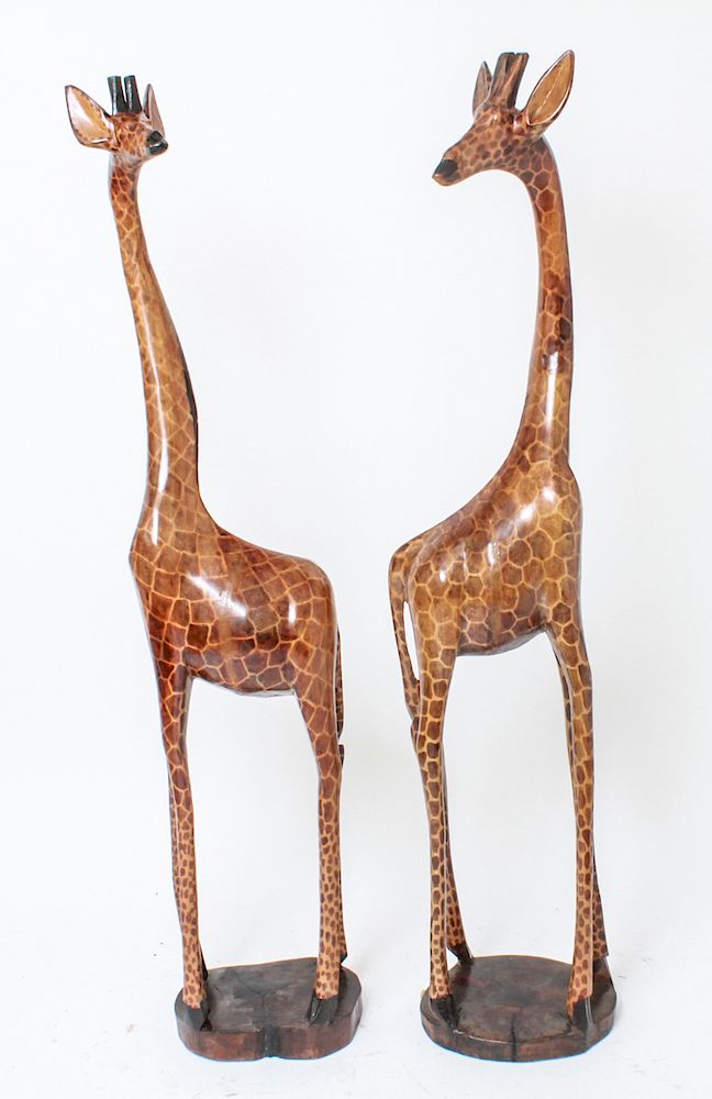 Appraisal: Carved Wood Painted Giraffe Figures Pair Pair of wood and