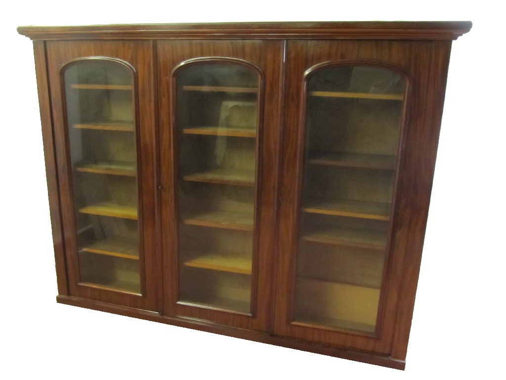 Appraisal: A Victorian mahogany bookcase the stepped cornice raised over three