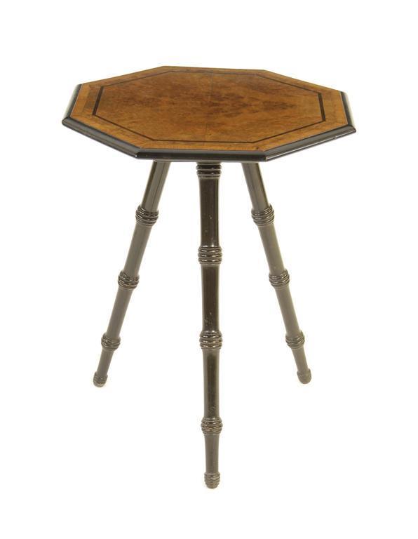 Appraisal: A late Victorian burr walnut and ebonised tripod table