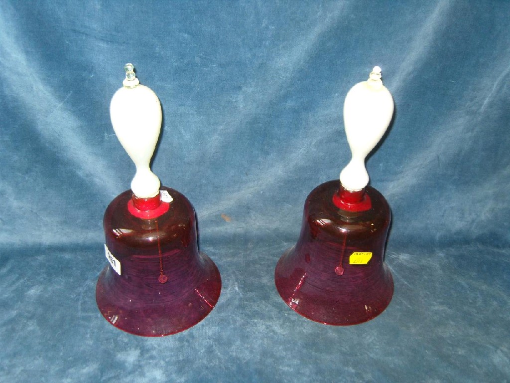 Appraisal: A pair of th century cranberry glass bells with Vaseline