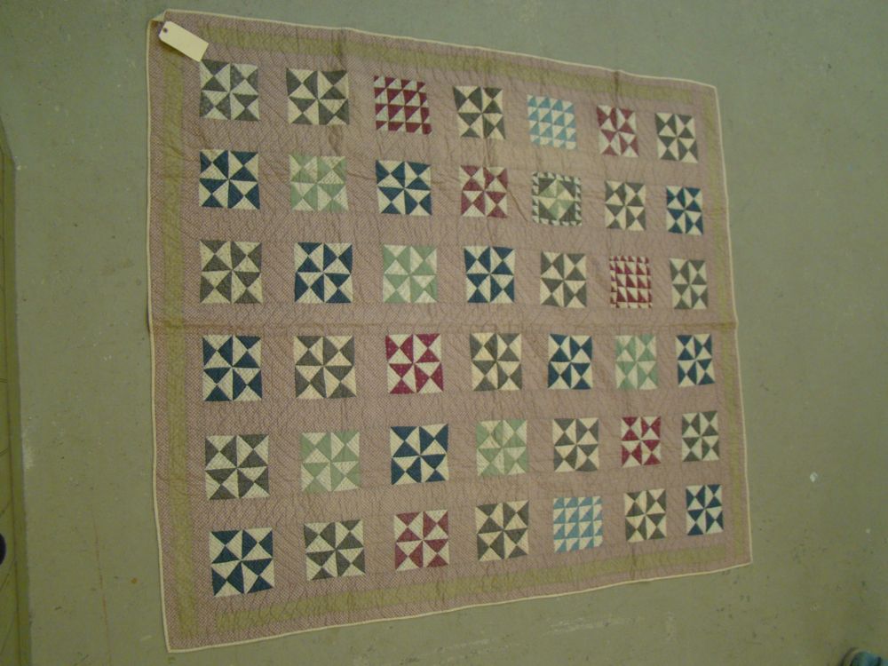 Appraisal: PIECED QUILT Late th Early th CenturyIn a multicolor triangular