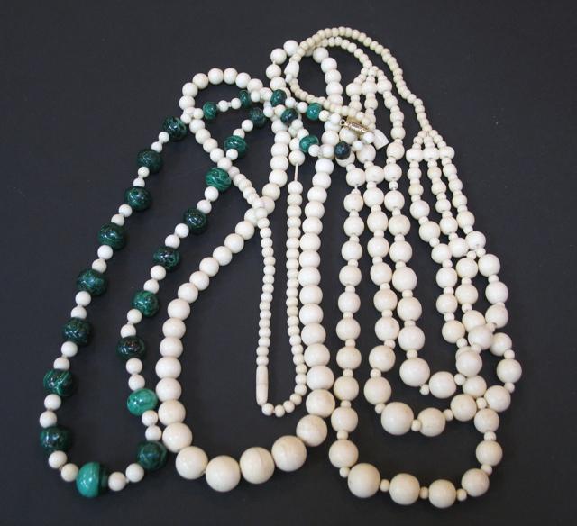 Appraisal: A GRADUATED STRING OF IVORY BEADS a similar string with