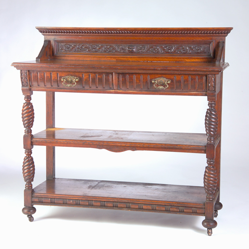 Appraisal: American Victorian oak server with two fluted drawers carved back