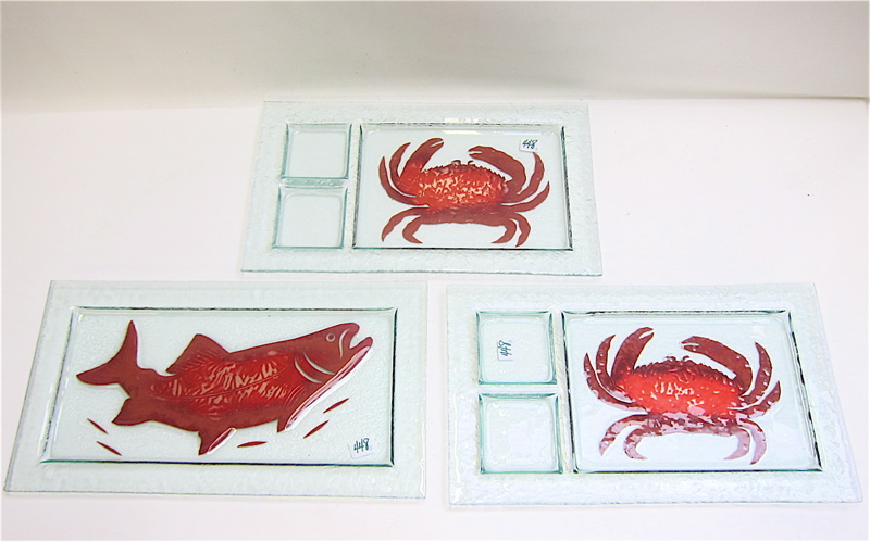 Appraisal: THREE STUDIO ART GLASS SEAFOOD PLATTERS pair having red crab