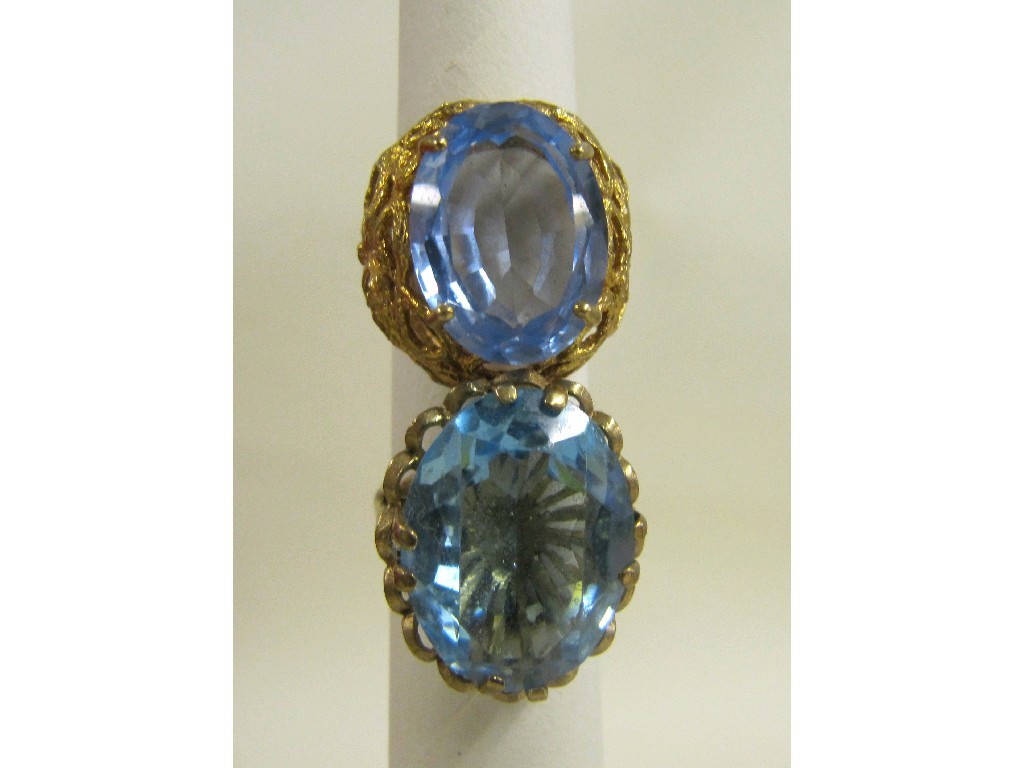 Appraisal: Two ct gold blue topaz single stone rings