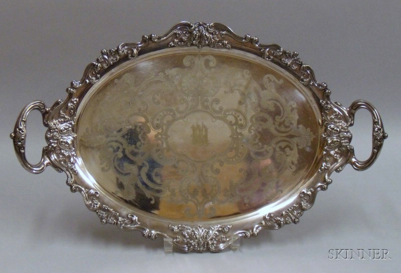 Appraisal: Silver Plated Two-Handled Tray scrolled edge decoration with medallion monogram