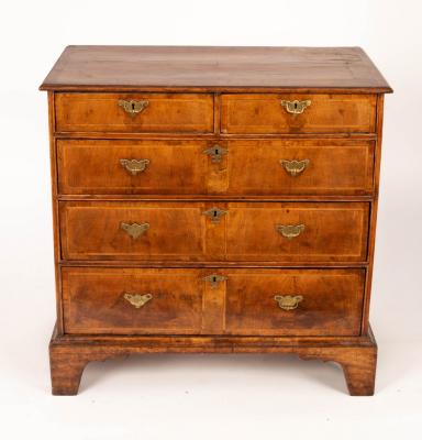 Appraisal: An th Century walnut chest of three long and two