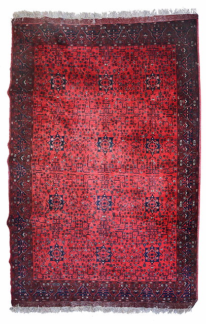 Appraisal: A MODERN AFGHAN CARPET decorated three rows of four star