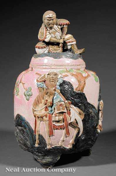 Appraisal: A Japanese Relief Decorated Earthenware Covered Tripod Urn probably Meiji