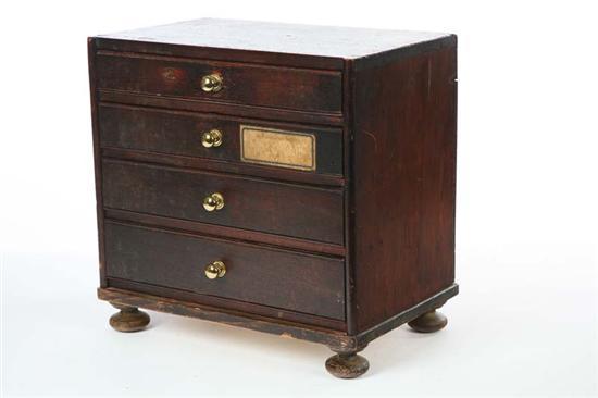 Appraisal: MINIATURE CHEST Softwood three drawer chest with bun feet h