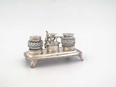 Appraisal: A George III inkstand of rounded oblong form with a