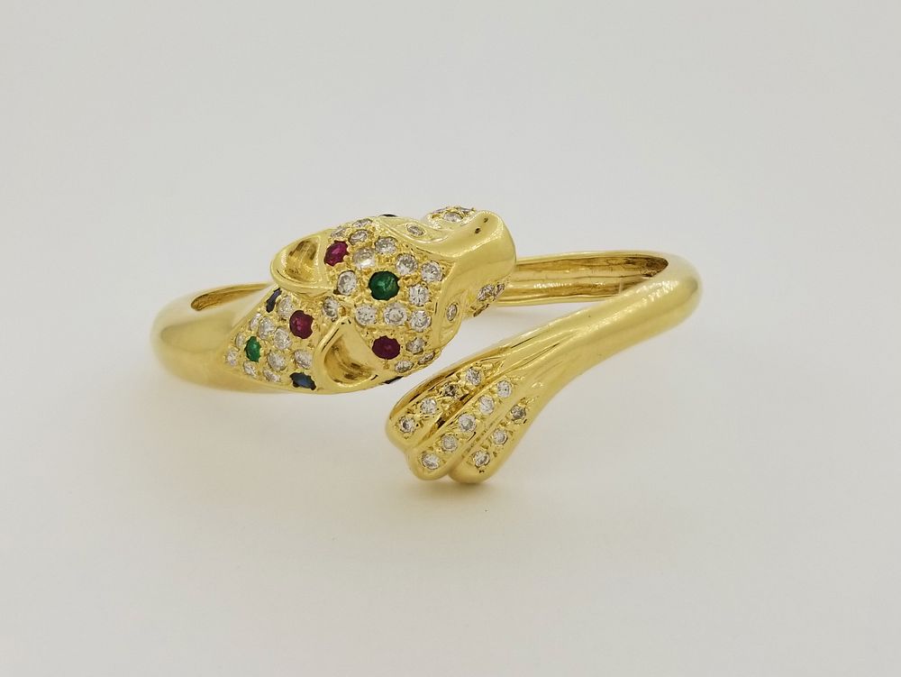 Appraisal: K Gold Precious Stone Panther Bangle K Gold Ruby Emerald